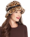 Call of the wild. Add something exotic to your everyday style with this this fun faux fur hat, featuring posh leopard-print and buckle accent. From nine West.