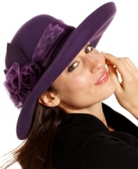 Add a little romance to your everyday accessorizing with this fabulous felt hat from August. The feminine silhouette is accented with tonal ribbon and exquisite floral detail. Add a little romance to your everyday accessorizing with this fabulous felt hat from August. The feminine silhouette is accented with tonal ribbon and exquisite floral detail.