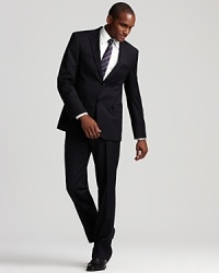 Two button, single breasted jacket with front flap pockets, chest pocket. Four interior pockets. Four decorative buttons at cuffs, double back vents. Flat front trousers have angle pockets, back besom pockets. Unfinished hems. Two button, single breasted jacket with front flap pockets, chest pocket. Four interior pockets. Four decorative buttons at cuffs, double back vents. Flat front trousers have angle pockets, back besom pockets. Unfinished hems.