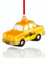 Hail this fun taxi cab ornament for a holiday filled with New York cheer. Featuring gold glitter accents on painted glass for a look of glamorous uptown style. With 2012 license plate. Hail this fun taxi cab ornament for a holiday filled with New York cheer. Featuring gold glitter accents on painted glass for a look of glamorous uptown style. With 2012 license plate.
