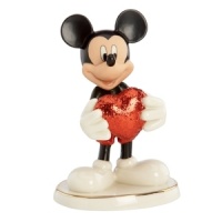 With a heart of bold red, Mickey Mouse shows he's totally smitten in this adorable Disney figurine. Glazed and glitter accents in Lenox fine china add even more to love. With a heart of bold red, Mickey Mouse shows he's totally smitten in this adorable Disney figurine. Glazed and glitter accents in Lenox fine china add even more to love.