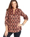 Jazz up your neutral bottoms with Jones New York Signature's printed plus size top.
