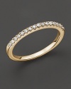 An elegant diamond ring in 14 Kt. yellow gold that can be worn stacked.