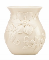 Already teeming with fresh blooms, Floral Fields posey vases from Lenox have a serene, understated elegance in graceful ivory porcelain. A simple silhouette balances elaborate sculpted detail. Already teeming with fresh blooms, Floral Fields posey vases from Lenox have a serene, understated elegance in graceful ivory porcelain. A simple silhouette balances elaborate sculpted detail.