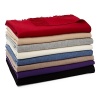 An ultra-soft and luxurious cashmere throw adds warmth and elegance to a room.
