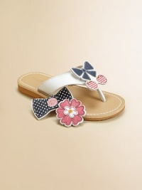 Choose a design to fit her mood: these adorable thong sandals come with three interchangeable grip-tape appliqués to complement her character or style for the day.Grip-tape appliqués include flowers, bow with cherries or bow with buttonsLeather upperPolyurethane liningPolyurethane soleImported