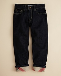 Burberry trades in classic jean stylings, rendering the Mini Prestley jean in a rich blue rinse, adding a touch of check at the turned-up cuffs. Burberry trades in classic jean stylings, rendering the Mini Prestley jean in a rich blue rinse, adding a touch of check at the turned-up cuffs.