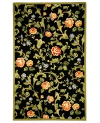 Midnight in the garden. The rich, black surface of this bewitching rug from Safavieh provides a dramatic backdrop for the leafy plumes, salmon-colored blossoms and delicate violets woven in. Handmade for superior detail, this elegant rug belongs in any room where taste is paramount. Woven of virgin wool with a durable cotton backing. (Clearance) Midnight in the garden. The rich, black surface of this bewitching rug from Safavieh provides a dramatic backdrop for the leafy plumes, salmon-colored blossoms and delicate violets woven in. Handmade for superior detail, this elegant rug belongs in any room where taste is paramount. Woven of virgin wool with a durable cotton backing. (Clearance)