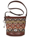 Simple and seriously chic, this cool crossbody from Fossil reels in old school charm with a contemporary attitude. Mod tapestry, leather trim and signature hardware add depth and dimension, while the spacious interior stashes your everyday essentials with ease.