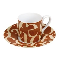 Whimsical drinkware to add fun and color to the table. Konitz mugs feature the highest quality color and glaze. A collage of biege, jumbled letters on a brown ground. Whimsical drinkware to add fun and color to the table. Konitz mugs feature the highest quality color and glaze. A collage of biege, jumbled letters on a brown ground.