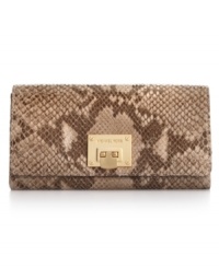 Get organized in the most exotic way with this posh, python-embossed leather carryall from MICHAEL Micahel Kors. Ideally sized to tuck under an arm or slip inside a handbag, it boasts plenty of pockets and compartments for all the essentials.