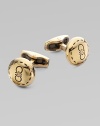 Round brass design engraved with iconic double gancini details, in a unique goldtone.BrassAbout ½ diam.Made in Italy