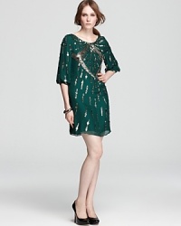 Detailed in shimmering pailettes, this Mark + James by Badgley Mischka dress brings in the season in a rich jewel-tone hue. Detailed in shimmering pailettes, this Mark + James by Badgley Mischka dress brings in the season in a rich jewel-tone hue.