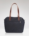 Classic navy canvas gets a handsome lift with smooth leather straps on this versatile Jade Spade tote.