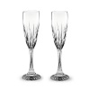 Beveled cuts of varying heights add grandeur to Baccarat's Juputer Champagne flutes.