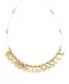 Shake up your style in rich metallics. This effortlessly elegant necklace by Nine West features polished, gold tone mixed metal discs strung from a delicate beaded chain. Approximate length: 16 inches.