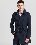 A classic Burberry trench gains versatility with the addition of a zip-out liner--branded in a signature check print.