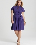 Pairing a fit-and-flare silhouette with a peppy purple hue, this Tahari Woman Plus dress lends a playful spirit to your daily look. Finish the style with printed flats and quirky bangles for eclectic charm.