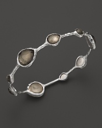Faceted pyrite doubles dot a sterling silver bangle from Ippolita. Faceted pyrite doubles dot a sterling silver bangle from Ippolita.