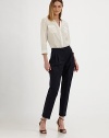 This cropped, crisply pleated design is impeccably tailored for a flattering fit.Self waistband with belt loops and back notchZip fly with hook-and-bar closureFront pleatsCuffed legBack button welt pocketsInseam, about 2766% linen/32% cotton/2% elastaneDry cleanMade in Italy of imported fabricModel shown is 5'9½ (176cm) wearing US size 4.OUR FIT MODEL RECOMMENDS ordering true size. 