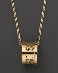 Gucci's iconic Gs circle a gleaming pendant of 18K yellow gold. Gucci's iconic Gs circle a gleaming pendant of 18K yellow gold.