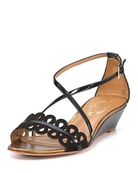 With dainty eyelet styling, slim straps and a ladylike little wedge, Elie Tahari's sandals pair perfectly with an airy sundress. With dainty eyelet styling, slim straps and a ladylike little wedge, Elie Tahari's sandals pair perfectly with an airy sundress.