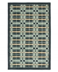 A traditional basketweave plaid is updated for the modern home in this area rug only from Martha Stewart rugs. Hand tufted in India of long wool fibers, this luxurious home accent presents unparalleled comfort and style underfoot. A traditional basketweave plaid is updated for the modern home in this area rug only from Martha Stewart rugs. Hand tufted in India of long wool fibers, this luxurious home accent presents unparalleled comfort and style underfoot.