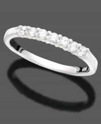This slender anniversary ring captures love and elegance with seven round-cut diamonds (1/4 ct. t.w.) in 14k white gold. This slender anniversary ring captures love and elegance with seven round-cut diamonds (1/4 ct. t.w.) in 14k white gold.