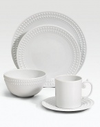 An elegantly detailed charger is made entirely by hand in fine Limoges porcelain with a raised pearl border. From the Perlee White Collection Porcelain 12½ diam. Dishwasher safe Imported 