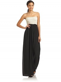 THE LOOKContrasting smocked bustRuffled trimWide leg silhouetteTHE FITAbout 54 from top to hemTHE MATERIALPolyesterCARE & ORIGINDry cleanImportedModel shown is 5'9 (175cm) wearing US size Small. THE LOOKContrasting smocked bustRuffled trimWide leg silhouetteTHE FITAbout 54 from top to hemTHE MATERIALPolyesterCARE & ORIGINDry cleanImportedModel shown is 5'9 (175cm) wearing US size Small.