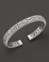 Gothic stations detailed in white sapphires decorate this Judith Ripka cuff.