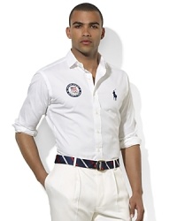 Our crisp poplin dress shirt offers a precise and patriotic look with our iconic embroidered Tournament Pony and USA Olympic logo in honor of the USA's participation in the 2012 Olympics. Our crisp poplin dress shirt offers a precise and patriotic look with our iconic embroidered Tournament Pony and USA Olympic logo in honor of the USA's participation in the 2012 Olympics.