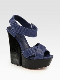 Intricately stitched leather design enhanced by a wide Velcro® strap and '70's-inspired block heel. Painted cork heel, 5 (125mm)Covered platform, 1½ (40mm)Compares to a 3½ heel (90mm)Leather upperLeather lining and solePadded insoleImportedOUR FIT MODEL RECOMMENDS ordering one half size up as this style runs small. Intricately stitched leather design enhanced by a wide Velcro® strap and '70's-inspired block heel. Painted cork heel, 5 (125mm)Covered platform, 1½ (40mm)Compares to a 3½ heel (90mm)Leather upperLeather lining and solePadded insoleImportedOUR FIT MODEL RECOMMENDS ordering one half size up as this style runs small.
