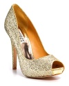 Add some glamour to a simple dress: Goldtone, glitter peep toe pumps with a tall covered heel and platform.