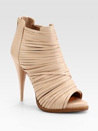 A piercing cone heel lifts this strappy leather silhouette with an open toe and hidden platform. Self-covered heel, 4¾ (120mm)Hidden platform, ¾ (20mm)Compares to a 4 heel (100mm)Leather upperOpen toeBack zipLeather lining and solePadded insoleMade in Italy A piercing cone heel lifts this strappy leather silhouette with an open toe and hidden platform. Self-covered heel, 4¾ (120mm)Hidden platform, ¾ (20mm)Compares to a 4 heel (100mm)Leather upperOpen toeBack zipLeather lining and solePadded insoleMade in Italy