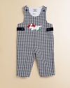 A charming one-piece in an overall design with a check pattern and puppy appliqué.ScoopneckShoulder straps with button closureSide buttonsBottom snaps65% cotton/35% rayonDry cleanImported Please note: Number of buttons and snaps may vary depending on size ordered. 