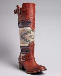 Stand tall, Southwestern style, in FREEBIRD by Steven's trailblazing boots. Pairing distressed leather and blanket-patterned fabric, they are as timeless as your favorite turquoise-and-silver jewelry. Stand tall, Southwestern style, in FREEBIRD by Steven's trailblazing boots. Pairing distressed leather and blanket-patterned fabric, they are as timeless as your favorite turquoise-and-silver jewelry.