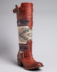 Stand tall, Southwestern style, in FREEBIRD by Steven's trailblazing boots. Pairing distressed leather and blanket-patterned fabric, they are as timeless as your favorite turquoise-and-silver jewelry.