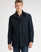 Fit and functionality are key elements of this well-crafted field jacket, inspired by traditional outerwear pieces. Elbow patches, a stand collar with buckle detail and an array of pockets combines endless comfort and versatility with a signature finish.Zip-frontSnap-button placketStand collarZippered chest, waist flap pocketsSide ventsAbout 29 from shoulder to hemPolyesterMachine washImported