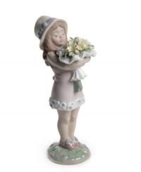 This very precious young lady clutches a spring bouquet of yellow daisies. A charming and nostalgic moment, captured in blushing pastel-colored porcelain. 7 x 2. This very precious young lady clutches a spring bouquet of yellow daisies. A charming and nostalgic moment, captured in blushing pastel-colored porcelain. 7 x 2.