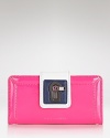 Color pop and lock it with this bold blue leather wallet from Juicy Couture, accented by gold tone hardware. It's billfold pockets perfect practicality, making this piece ideal for purse to palm style.