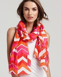 A lightweight chevron printed scarf with self fringe edges and a flashy color palette. A lightweight chevron printed scarf with self fringe edges and a flashy color palette.