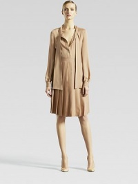 Silk georgette satin, in a pleated, long-sleeved design.Tie collarFront placket with metal buttonsLong sleeves with banded cuffsSelf waistbandSelf-lined pleated skirtSilkDry cleanMade in Italy of imported fabric Silk georgette satin, in a pleated, long-sleeved design.Tie collarFront placket with metal buttonsLong sleeves with banded cuffsSelf waistbandSelf-lined pleated skirtSilkDry cleanMade in Italy of imported fabric