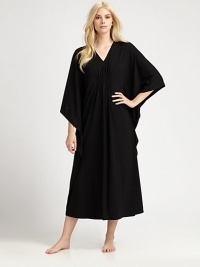 An elegant design with a gathered front and ruffled sides for comfortable, yet sophisticated look. V-neckThree-quarter length kimono sleevesGathered frontRuffled sidesPull-on styleAbout 50 from shoulder to waist67% polyester/33% rayonMachine washImported An elegant design with a gathered front and ruffled sides for comfortable, yet sophisticated look. V-neckThree-quarter length kimono sleevesGathered frontRuffled sidesPull-on styleAbout 50 from shoulder to waist67% polyester/33% rayonMachine washImported