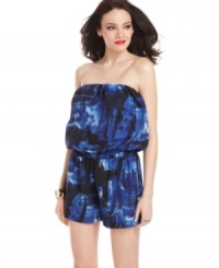 Light-up a balmy night in this romper from GUESS?, where an abstract print and voluminous, blouson silhouette lends urban style to a vacation-ready look! Light-up a balmy night in this romper from GUESS?, where an abstract print and voluminous, blouson silhouette lends urban style to a vacation-ready look!