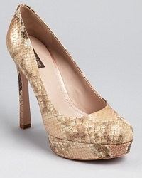 A classic pump from Joan & David--an ever-so-lightly curved heel adds a faint retro feel. Pair this staple shoe with flared pants for a throwback look. A classic pump from Joan & David--an ever-so-lightly curved heel adds a faint retro feel. Pair this staple shoe with flared pants for a throwback look.