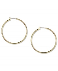 Go for big time fashion! These Anne Klein hoop earrings boast a large design and click-top closure. Crafted in gold tone mixed metal. Approximate diameter: 1-1/2 inches. Go for big time fashion! These Anne Klein hoop earrings boast a large design and click-top closure. Crafted in gold tone mixed metal. Approximate diameter: 1-1/2 inches.