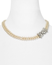 Feeling prim and proper? Accessorize a polished mood with this Carolee necklace, which features a double strand of pearls detailed by a crystal closure. Feeling prim and proper? Accessorize a polished mood with this Carolee necklace, which features a double strand of pearls detailed by a crystal closure.