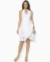 A foundation of airy tissue linen creates breezy style on Lauren by Ralph Lauren's sleeveless wrap dress, tailored with a chic V-neckline and ruffled cutaway hem for an ultra-feminine look.