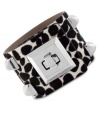 Animal magnetism. Vince Camurto designs this cuff bracelet with a snow leopard print and pyramid studs crafted from silver tone mixed metal. Finished with a turnlock closure. Approximate length: 8 inches.